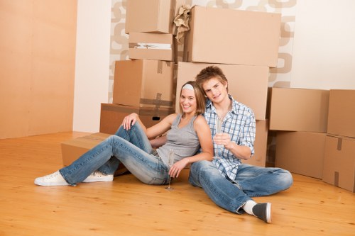 Professional movers navigating stairs in a period property in Islington