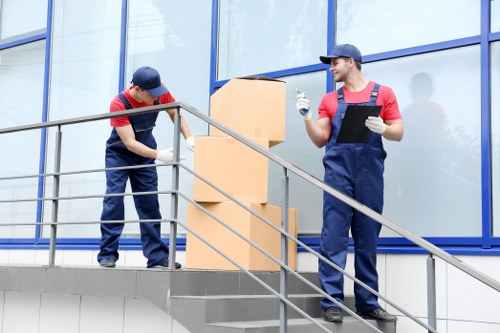 Removal van and moving team handling a residential move in Islington