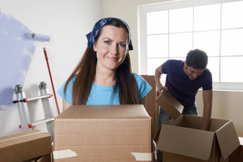 Removal van and moving team handling a flat move in Islington