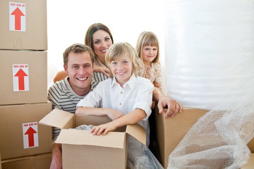 Packed boxes and furniture prepared for a flat move in Islington