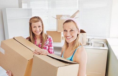 Relocation team moving desks and office items in London