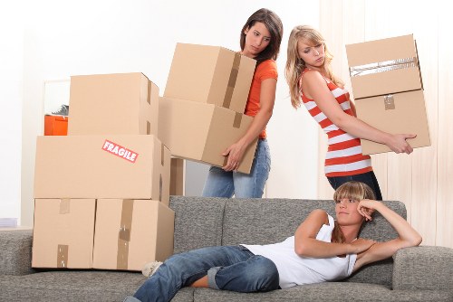 Loading furniture into a removal truck in a North London street